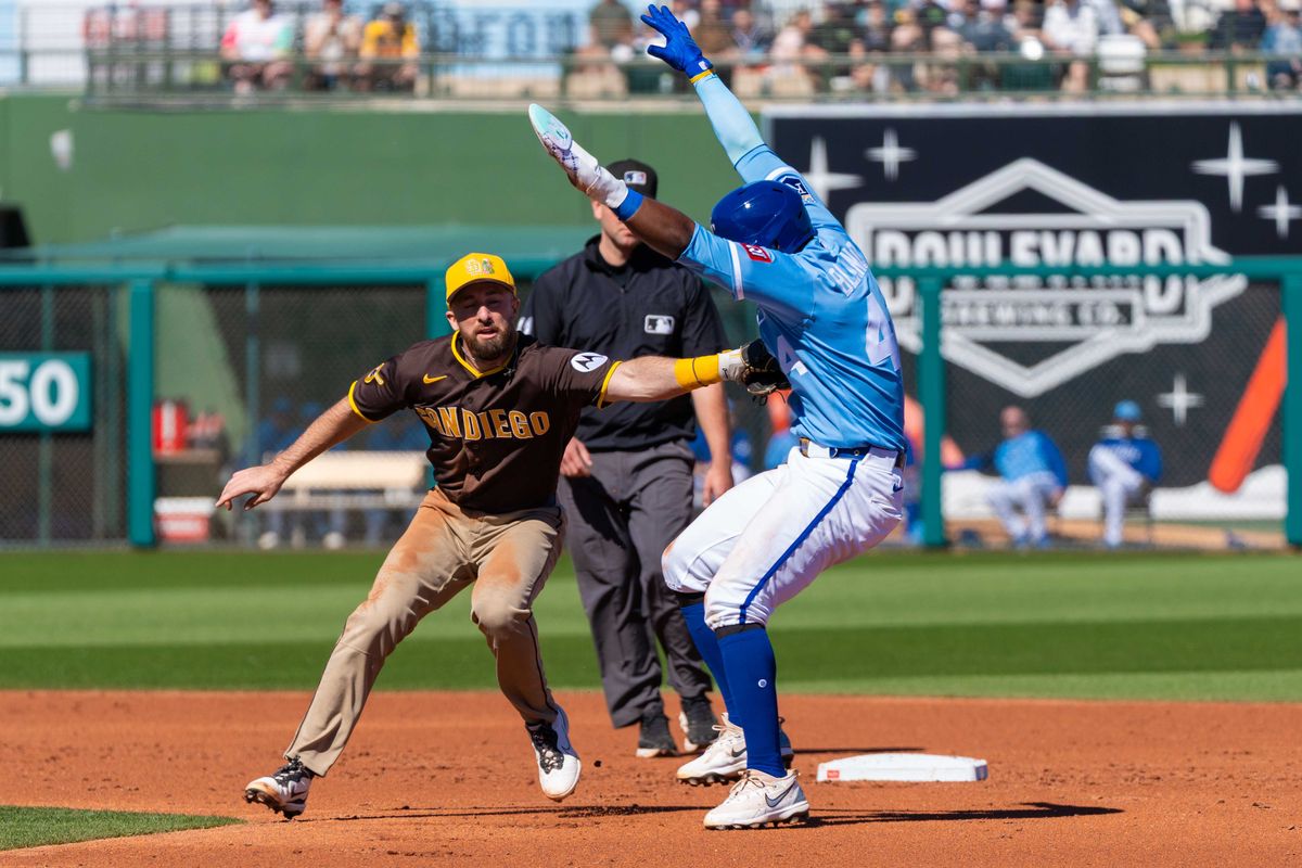 San Diego Padres infielder Mason McCoy (18) tags out the runner during an MLB Spring Training game between the San Diego Padres and the Kansas City Royals, Saturday February 21, 2026 at Surprise Stadium in Surprise, AZ. San Diego Padres infielder Mason McCoy (18) tags out the runner during an MLB Spring Training game between the San Diego Padres and the Kansas City Royals, Saturday February 21, 2026 at Surprise Stadium in Surprise, AZ.