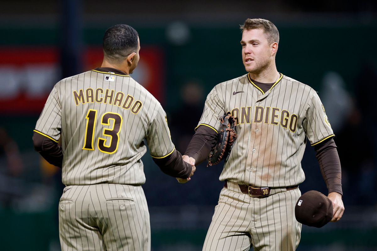 Gavin Sheets #30 and Manny Machado #13 celebrate a team victory over the Pirates at PNC Park on April 6, 2025 in Pittsburgh.