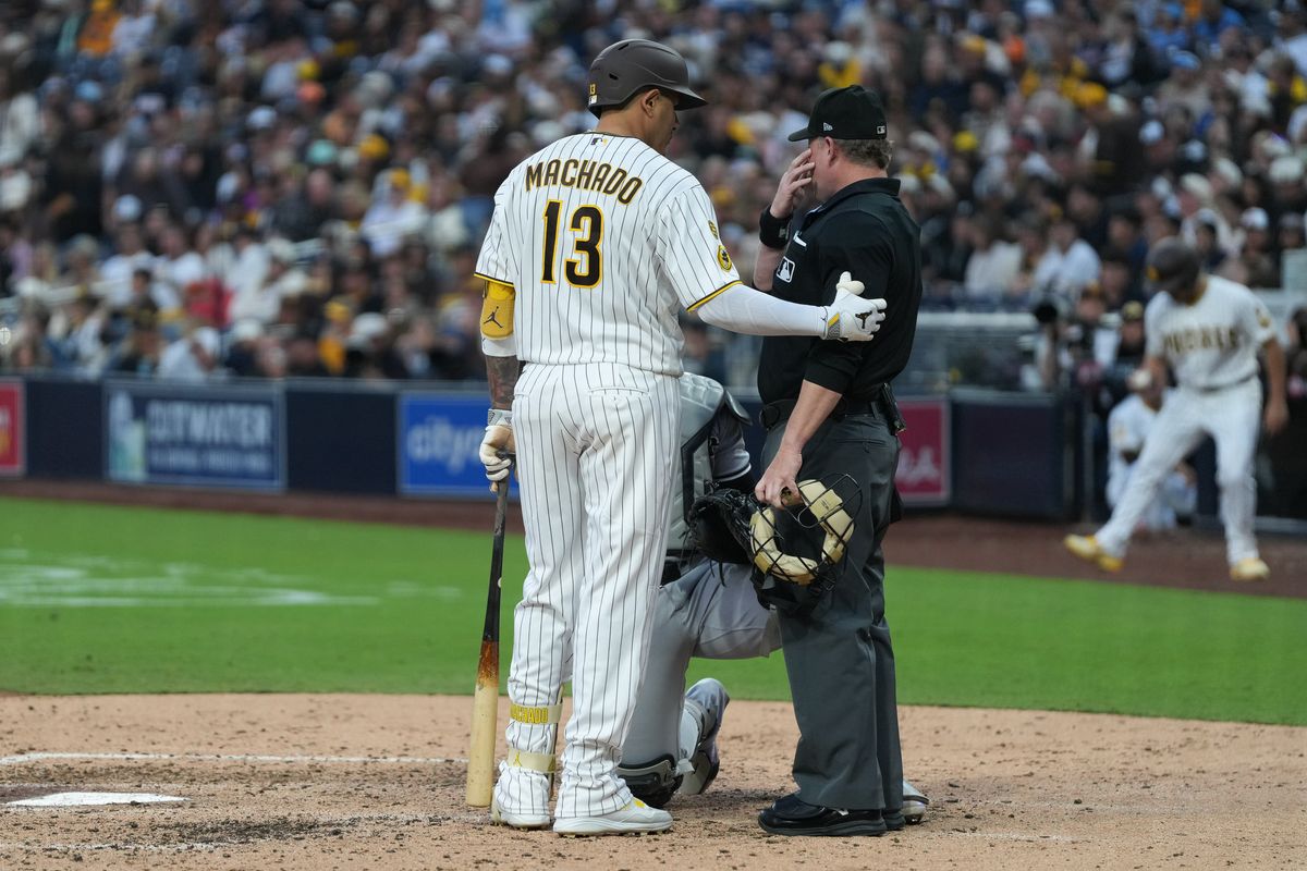 Padres third baseman Manny Machado (13) speaks to the umpire during an MLB baseball game against the White Sox, Saturday May 02, 2026 in San Diego, California.