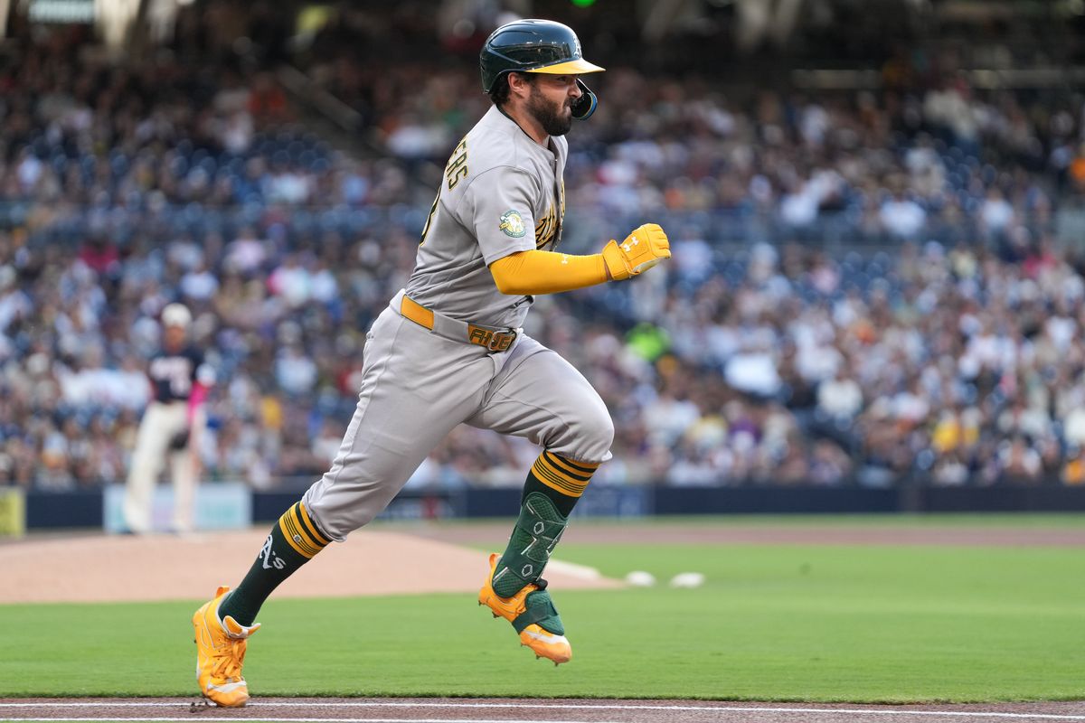 Athletics catcher Shea Langeliers (23) runs to first base during an MLB baseball game against the Padres, Friday May 22, 2026 in San Diego, California.