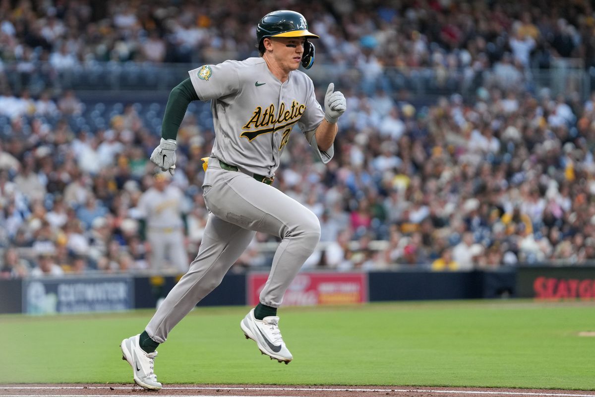Athletics third baseman Zack Gelof (20) runs to first base during an MLB baseball game against the Padres, Friday May 22, 2026 in San Diego, California.