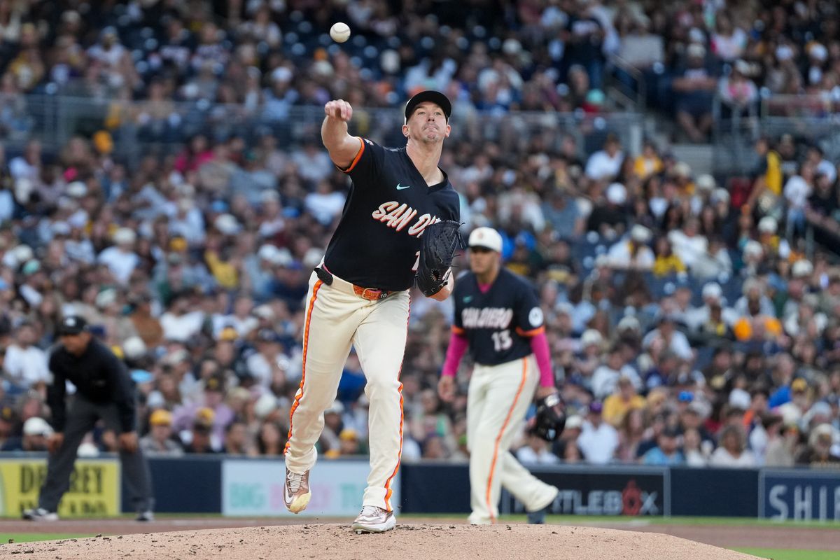 Padres starting pitcher Walker Buehler (10) throws the ball to first base during an MLB baseball game against the Athletics, Friday May 22, 2026 in San Diego, California.