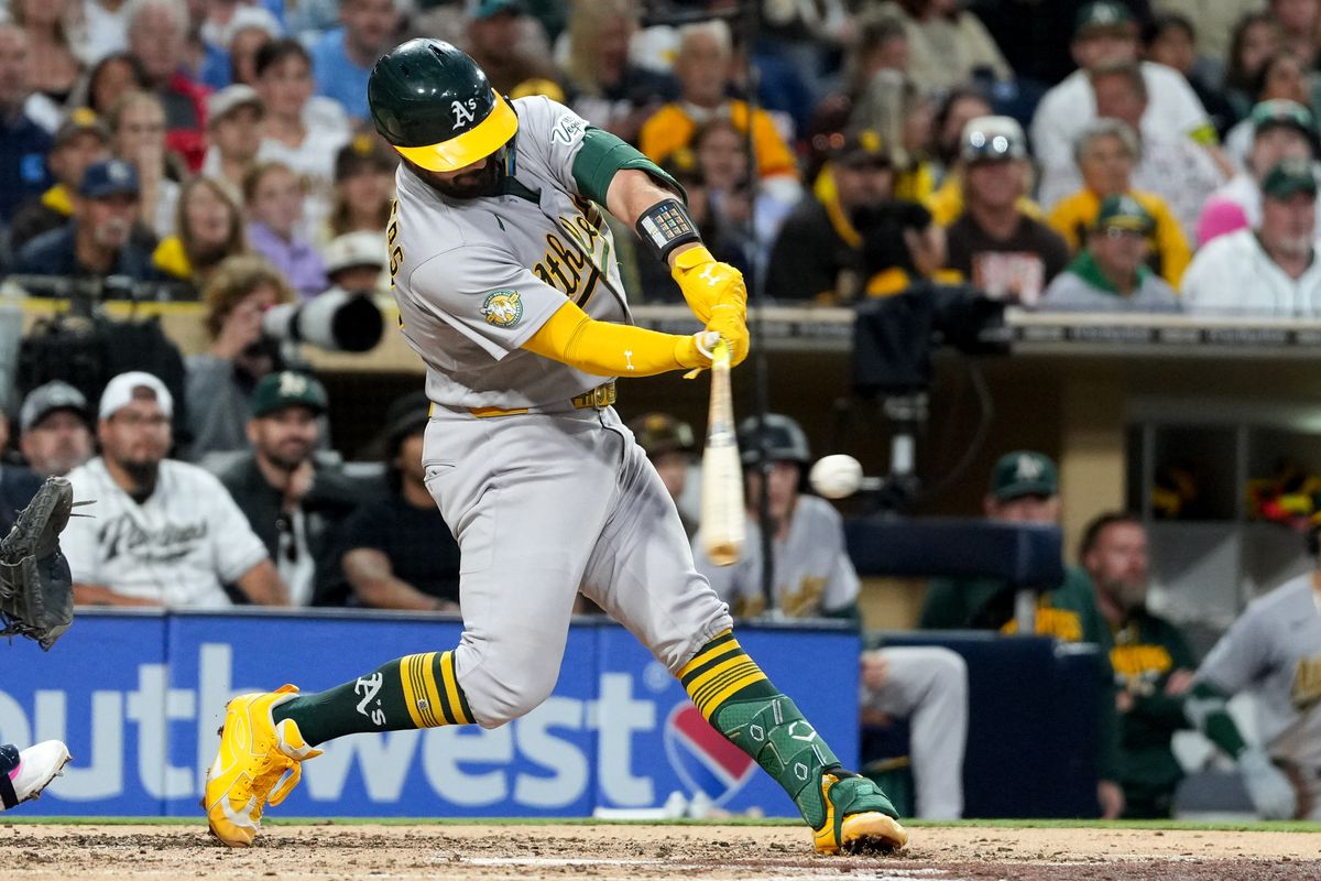 Athletics catcher Shea Langeliers (23) hits the ball during an MLB baseball game against the Padres, Friday May 22, 2026 in San Diego, California.