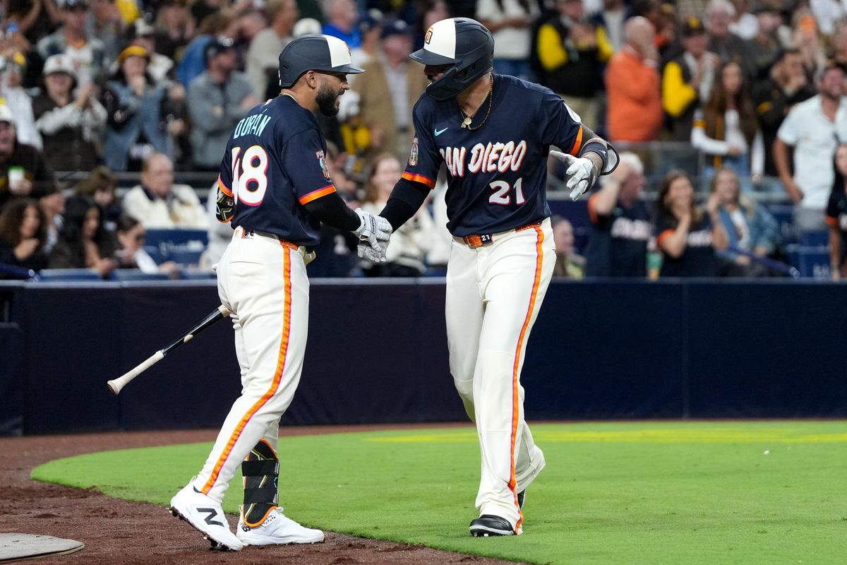 Padres right fielder Nick Castellanos (21) celebrates with Padres catcher Rodolfo Durán (48) after hitting a home run during an MLB baseball game against the Athletics, Friday May 22, 2026 in San Diego, California.