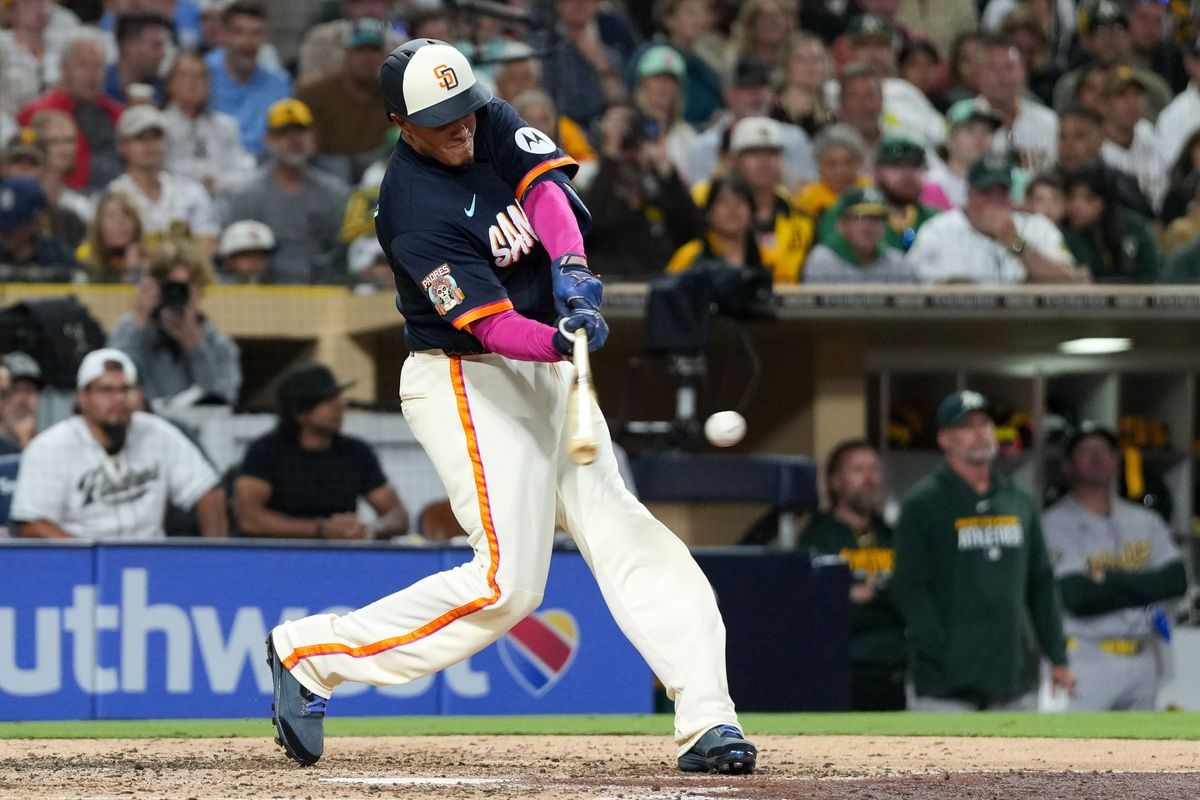 Padres third baseman Manny Machado (13) hits the ball during an MLB baseball game against the Athletics, Friday May 22, 2026 in San Diego, California.