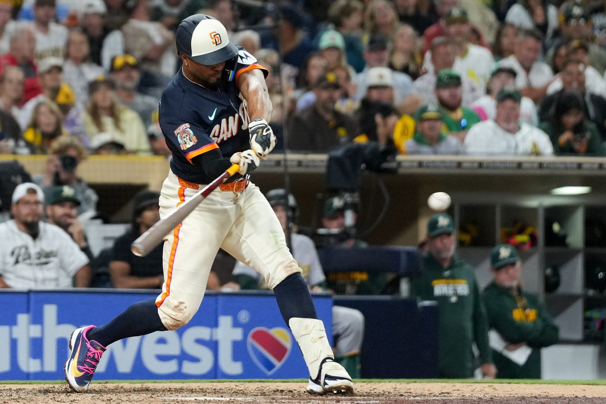Padres shortstop Xander Bogaerts (2) hits the ball during an MLB baseball game against the Athletics, Friday May 22, 2026 in San Diego, California.