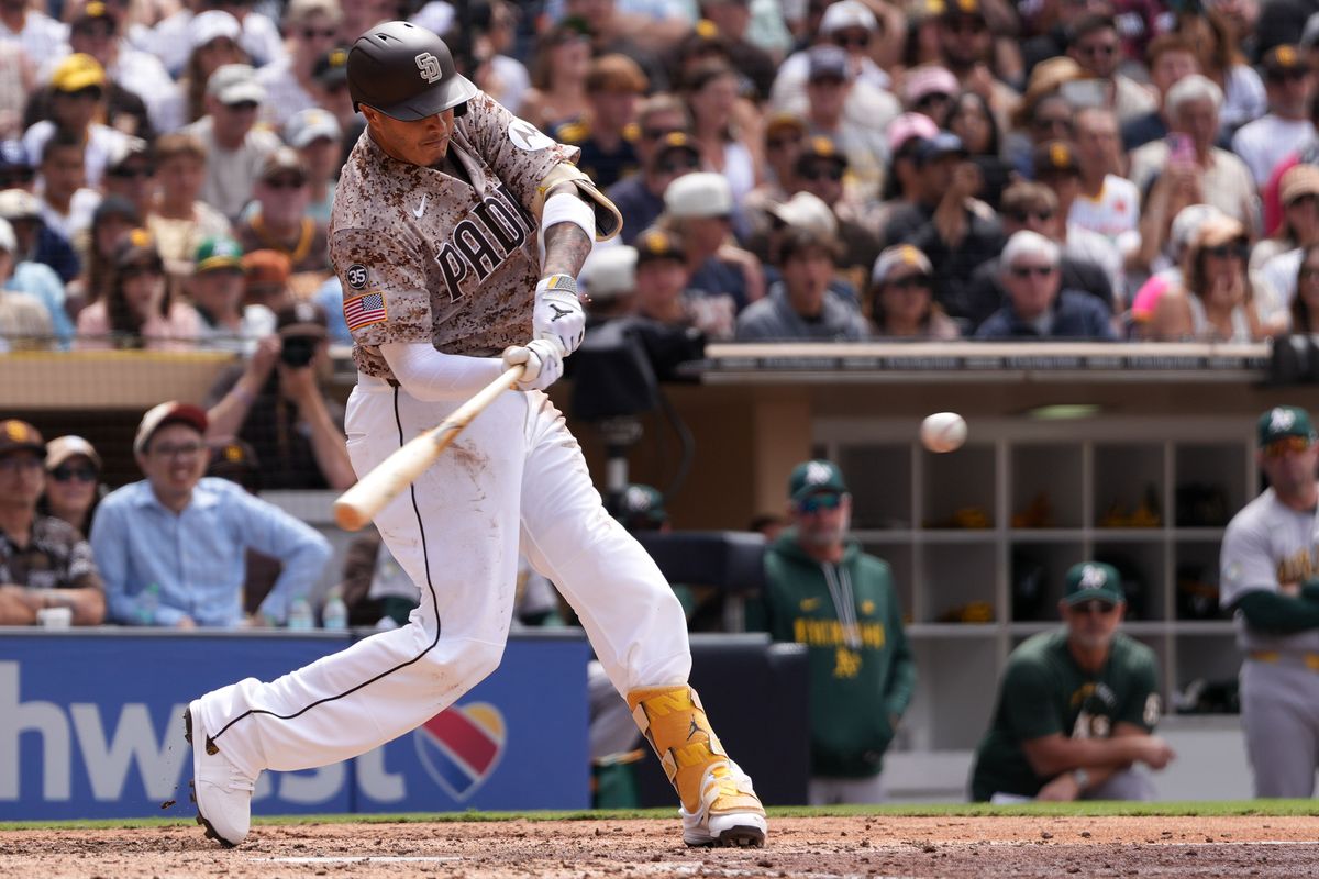Padres third baseman Manny Machado (13) hits the ball during an MLB baseball game against the Athletics, Sunday May 24, 2026 in San Diego, California. Padres third baseman Manny Machado (13) hits the ball during an MLB baseball game against the Athletics, Sunday May 24, 2026 in San Diego, California.