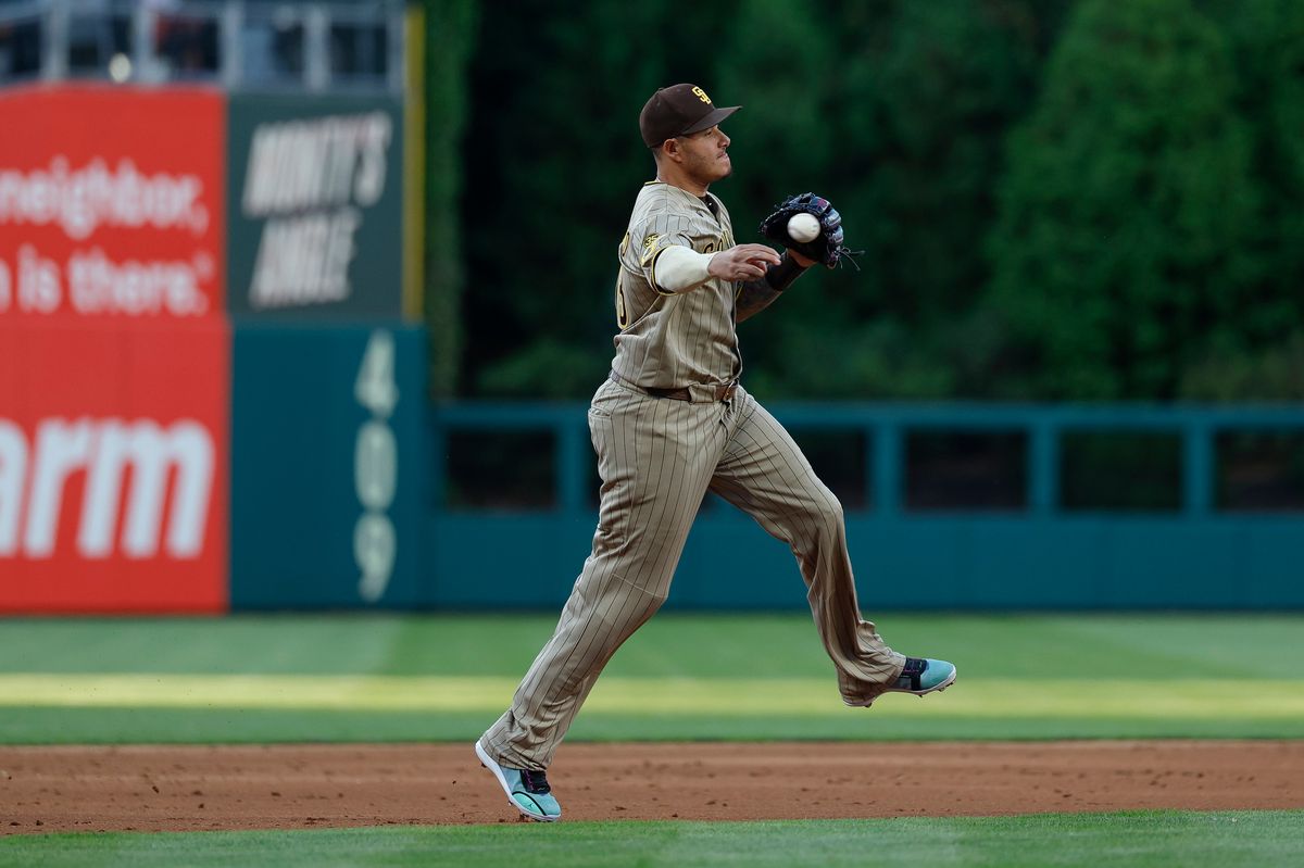Manny Machado #13 of the San Diego Padres throws to first base against the Philadelphia Phillies at Citizens Bank Park on June 3, 2026 in Philadelphia, Pennsylvania.