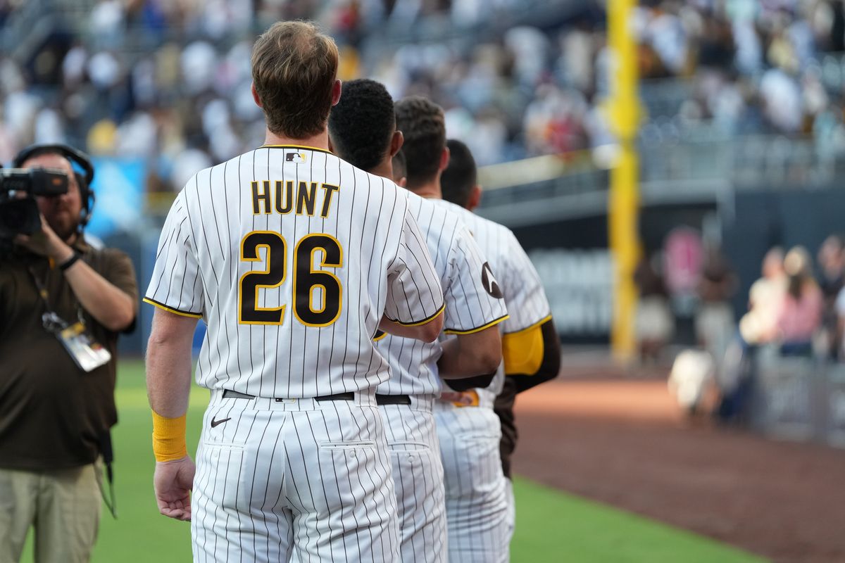 Padres catcher Blake Hunt (26) and teammates line up for the national anthem before an MLB baseball game against the Braves, Monday June 22, 2026 in San Diego, California. Padres catcher Blake Hunt (26) and teammates line up for the national anthem before an MLB baseball game against the Braves, Monday June 22, 2026 in San Diego, California.