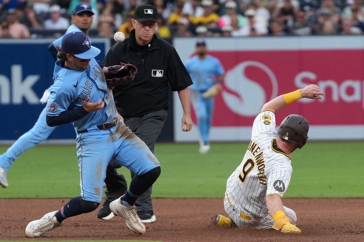 Padres second baseman Jake Cronenworth (9) slides to second base during an MLB baseball game against the Blue Jays, Saturday July 11, 2026 in San Diego, California. Padres second baseman Jake Cronenworth (9) slides to second base during an MLB baseball game against the Blue Jays, Saturday July 11, 2026 in San Diego, California.