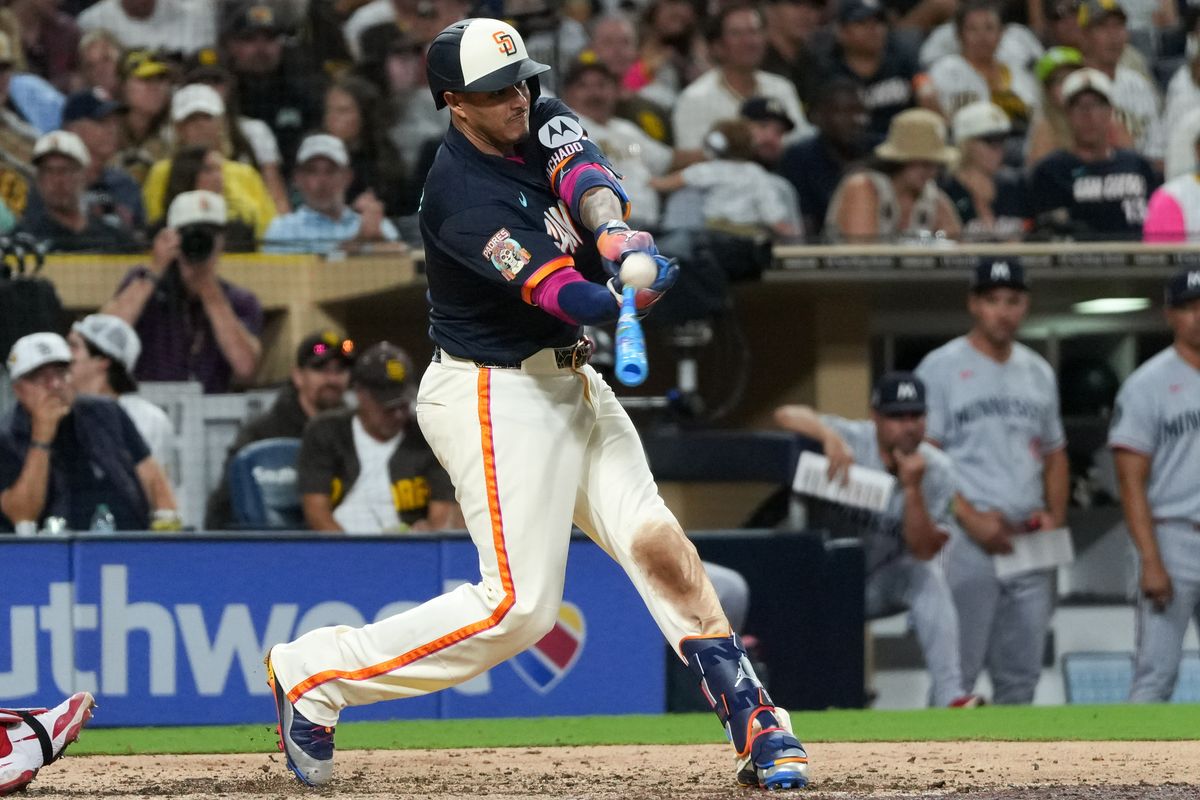 Padres third baseman Manny Machado (13) hits the ball during an MLB baseball game against the Twins, Friday August 21, 2026 in San Diego, California. Padres third baseman Manny Machado (13) hits the ball during an MLB baseball game against the Twins, Friday August 21, 2026 in San Diego, California.