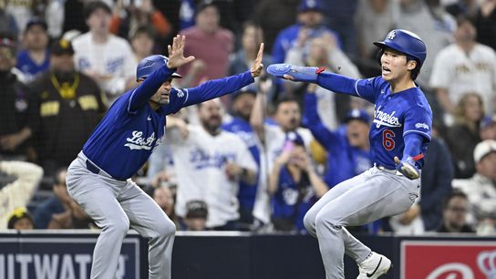 May 18, 2026; San Diego, California, USA; Los Angeles Dodgers third base coach Dino Ebel (91) holds shortstop Hyeseong Kim (6) at third base during the sixth inning against the San Diego Padres at Petco Park. May 18, 2026; San Diego, California, USA; Los Angeles Dodgers third base coach Dino Ebel (91) holds shortstop Hyeseong Kim (6) at third base during the sixth inning against the San Diego Padres at Petco Park.