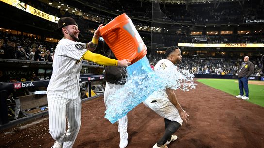 Apr 9, 2026; San Diego, California, USA; San Diego Padres center fielder Jackson Merrill (3) attempts to pour the contents of a beverage cooler over shortstop Xander Bogaerts (2) after Bogaerts hit a walk-off grand slam home run in the twelfth inning against the Colorado Rockies at Petco Park.