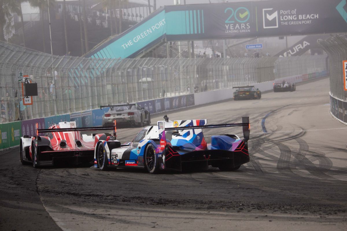 Drivers race around come around a turn on the track of the Grand Prix, which is made up of several Long Beach city streets near the Shoreline Village area converted into a race track.