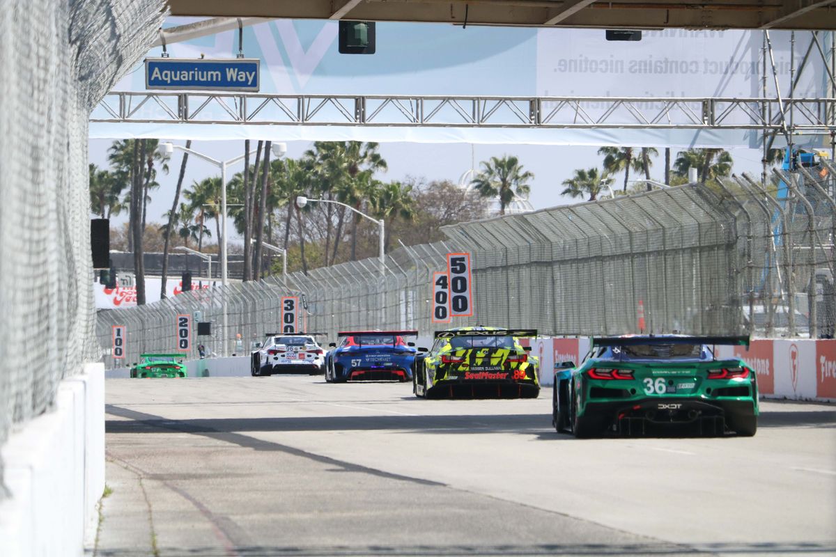  DXDT Racing's Corvette ZO6 GT3 R trails behind a line of drivers coming down a straight at the 2025 Acura Grand Prix of Long Beach. 