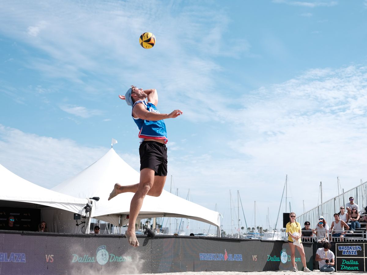 Brooklyn Blaze's Evan Cory goes up for a jump serve during a match between Brooklyn Blaze and Dallas Dream at the AVP Long Beach on Saturday, July 11, at Alamitos Beach, Long Beach Calif, Brooklyn Blaze's Evan Cory goes up for a jump serve during a match between Brooklyn Blaze and Dallas Dream at the AVP Long Beach on Saturday, July 11, at Alamitos Beach, Long Beach Calif,