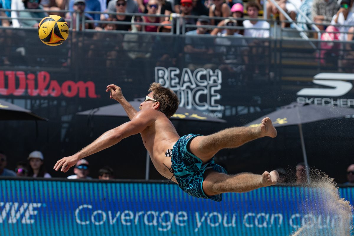 Taylor Crabb dives to keep the ball in play during the 2026 Manhattan Beach Open on Sunday, August 16, 2026 at Manhattan Beach Pier. Taylor Crabb dives to keep the ball in play during the 2026 Manhattan Beach Open on Sunday, August 16, 2026 at Manhattan Beach Pier.