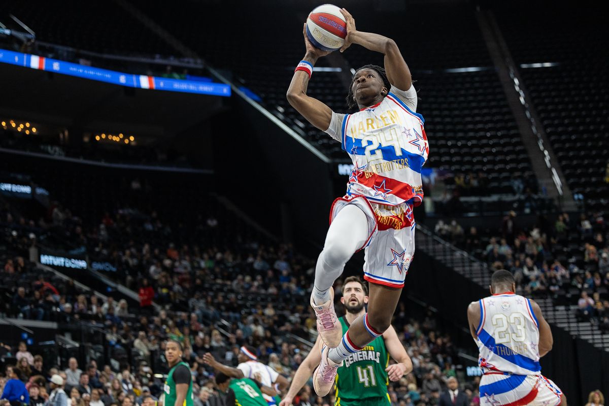 Harlem Globetrotters finisher Dragon Gilmore (24) shoots the ball during a Harlem Globetrotter basketball game against The Washington Generals, Friday February 20, 2026 in Los Angeles.