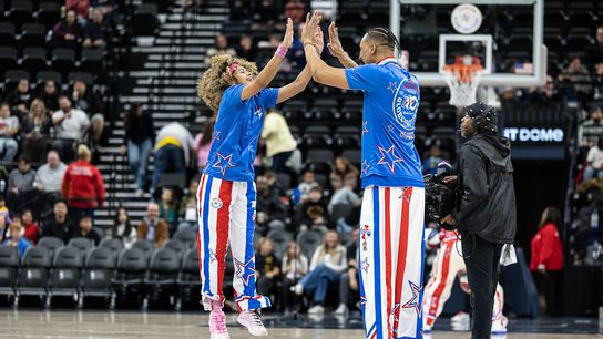 Harlem Globetrotters guard Sunshine West (8) celebrates during a Harlem Globetrotter basketball game against The Washington Generals, Friday February 20, 2026 in Los Angeles.