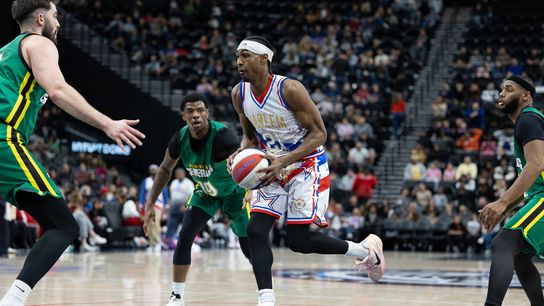 Harlem Globetrotters guard Lights Out Garcia (21) dribbles the ball during a Harlem Globetrotters basketball game against The Washington Generals, Friday February 20, 2026 in Los Angeles.