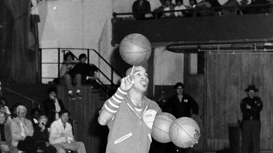 Harlem Globetrotters Curly Neal entertains the crowd prior to game against the Washington Generals at the Westchester County Center in White Plains Dec. 16, 1979. The Globetrotters won the game 82-60.