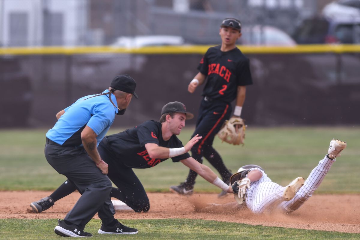 Huntington Beach Jason Dunham (56) tags out the baserunner during an High School Baseball game against   Temecula Valley Tuesday May 12, 2026 in Temecula, California.