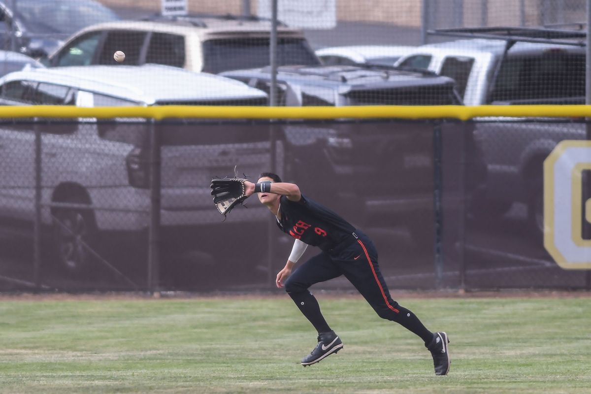 Huntington Beach Elyjah Mason (9) feels a fly ball during an High School Baseball game against Temecula Valley     Tuesday May 12, 2026 in Temecula, California.