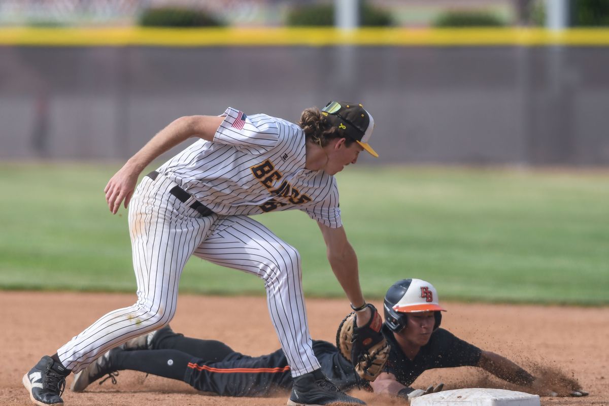 Huntington Beach Sol Moriyama (2) slides back to first ahead of the throw to Temecula Valley Chase Hilt (26) during an High School Baseball game against   Temecula Valley Tuesday May 12, 2026 in Temecula, California.