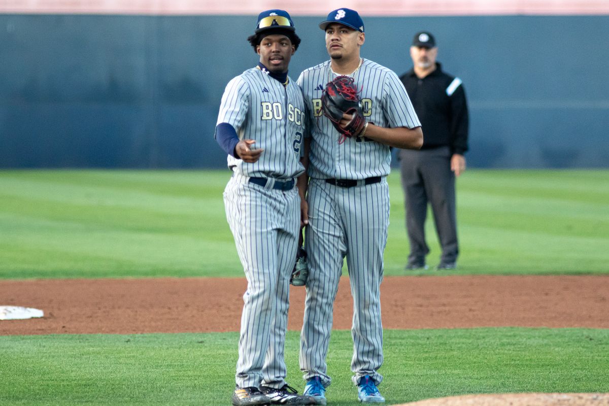 St. John Bosco High School Pitcher Julian Garcia #12 and Infielder Jaden Jackson #2 regroup during the CIF Championship game at Goodwin field on May 29, 2026 in Fullerton, California. St. John Bosco High School Pitcher Julian Garcia #12 and Infielder Jaden Jackson #2 regroup during the CIF Championship game at Goodwin field on May 29, 2026 in Fullerton, California.