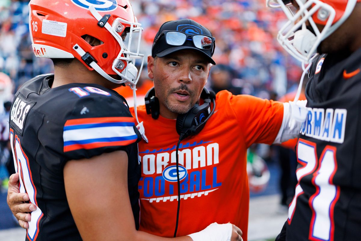 Jason Negro of Bishop Gorman High School hugs players during the game against St. John Bosco High School at Fertitta Field on August 21, 2026 in Las Vegas, Nevada. Jason Negro of Bishop Gorman High School hugs players during the game against St. John Bosco High School at Fertitta Field on August 21, 2026 in Las Vegas, Nevada.