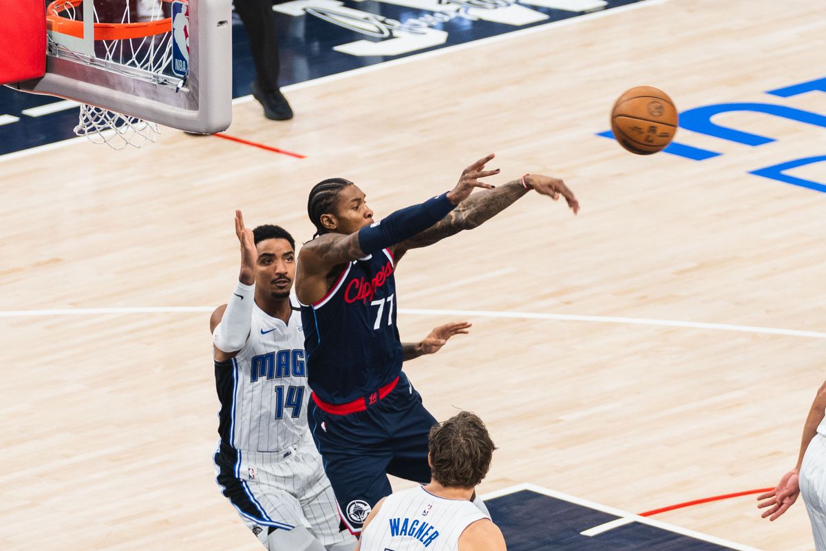 LA Clippers Guard Kevin Porter Jr. (77) dishing a pass to the corner during an NBA basketball game against the Orlando Magic, Wednesday November 20th, 2024 in Inglewood, California. 