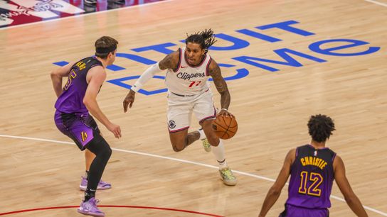 Los Angeles Clippers Kevin Porter Jr. (77) fights through a defender at an NBA basketball game against the Los Angeles Lakers, Sunday January 19th, 2025 in Inglewood, California. Los Angeles Clippers Kevin Porter Jr. (77) fights through a defender at an NBA basketball game against the Los Angeles Lakers, Sunday January 19th, 2025 in Inglewood, California.