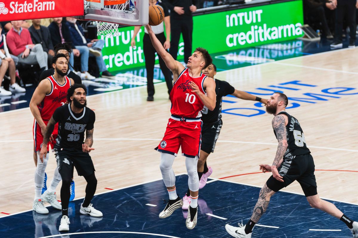 Los Angeles Clippers guard Bogdan Bogdanovic  (10) shoots a lay-up during an NBA basketball game against the San Antonio Spurs, Tuesday April 8th, 2025 in Inglewood, California. 
