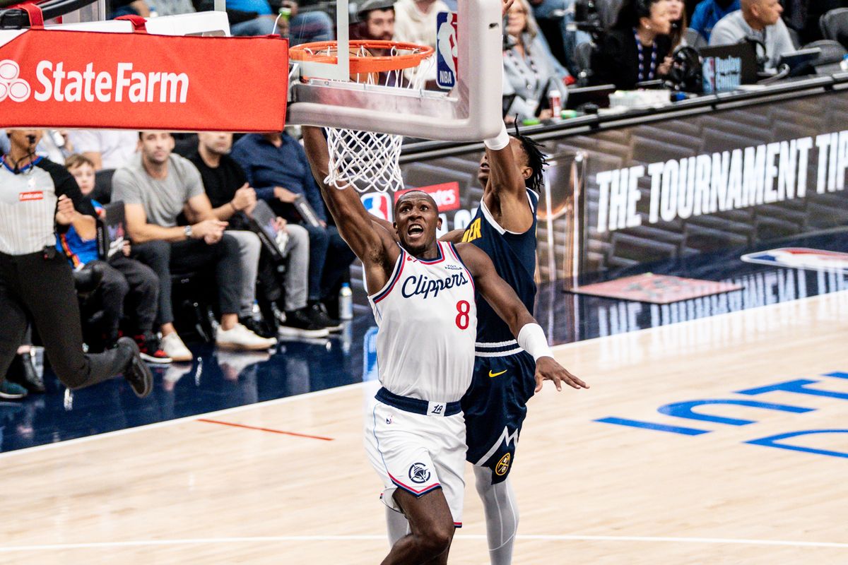 Los Angeles Clippers G Kris Dunn (8) attacks the rim and dunks during an NBA pre-season basketball game against the Denver Nuggets, Sunday October 12th, 2025 in Inglewood, California. 