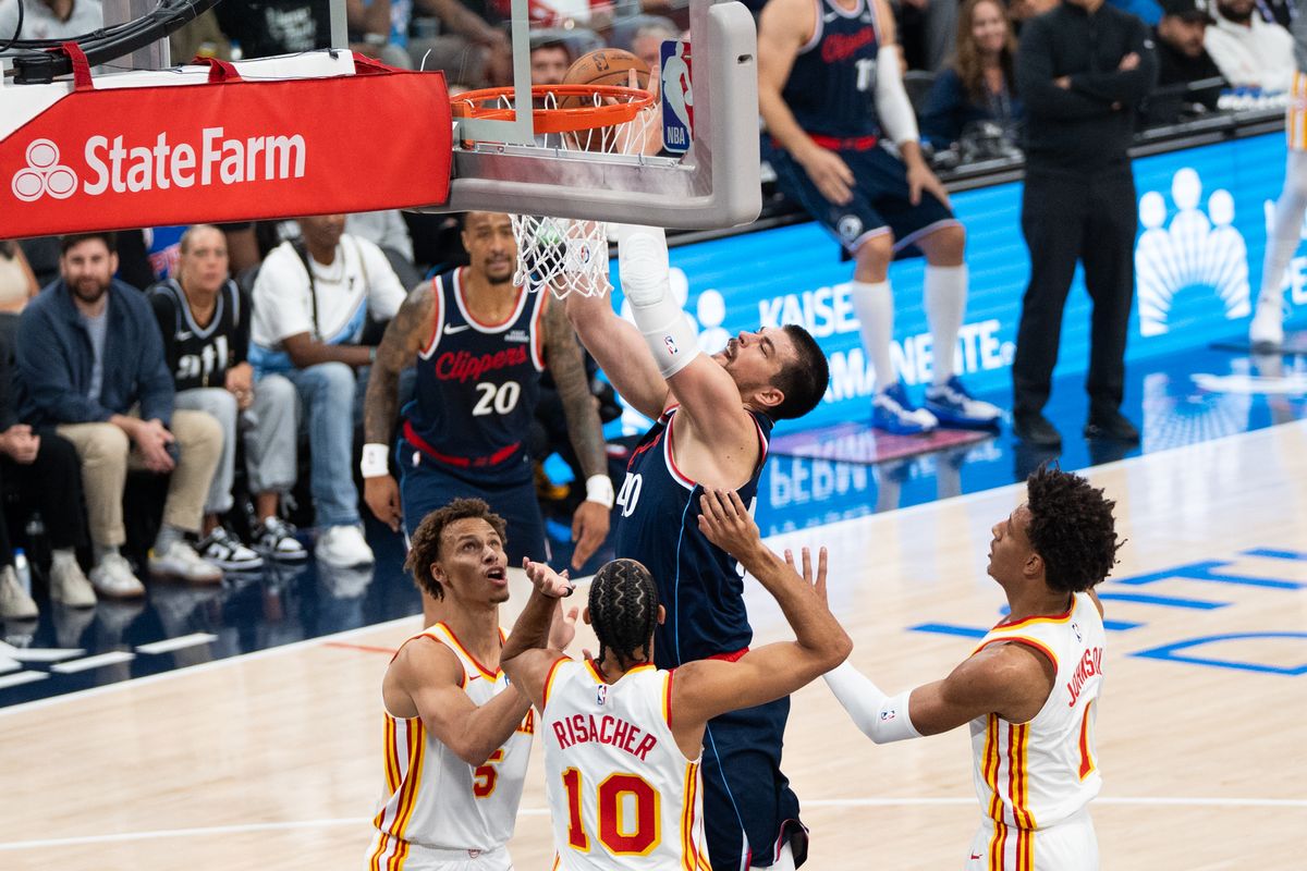 Los Angeles Clippers Center Ivica Zubac (40) goes up on three defenders in the paint at an NBA basketball game against the Atlanta Hawks, Monday November 10th, 2025 in Inglewood, California. 