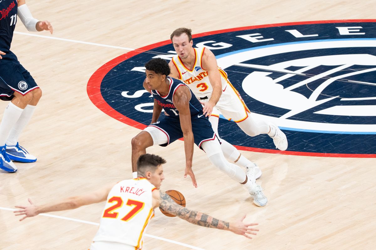 Los Angeles Clippers Guard Cam Christie (12) gets the defender on his back and attacks the lane at an NBA basketball game against the Atlanta Hawks, Monday November 10th, 2025 in Inglewood, California. 
