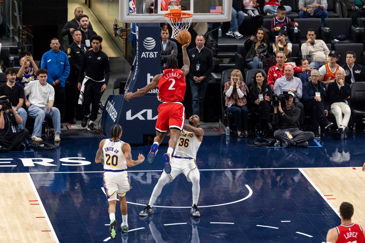 Kawhi Leonard #2 of the LA Clippers drives towards the rim and commits an offensive foul during an NBA basketball game against the Los Angeles Lakers, Saturday December 20, 2025 in Inglewood, Calif.