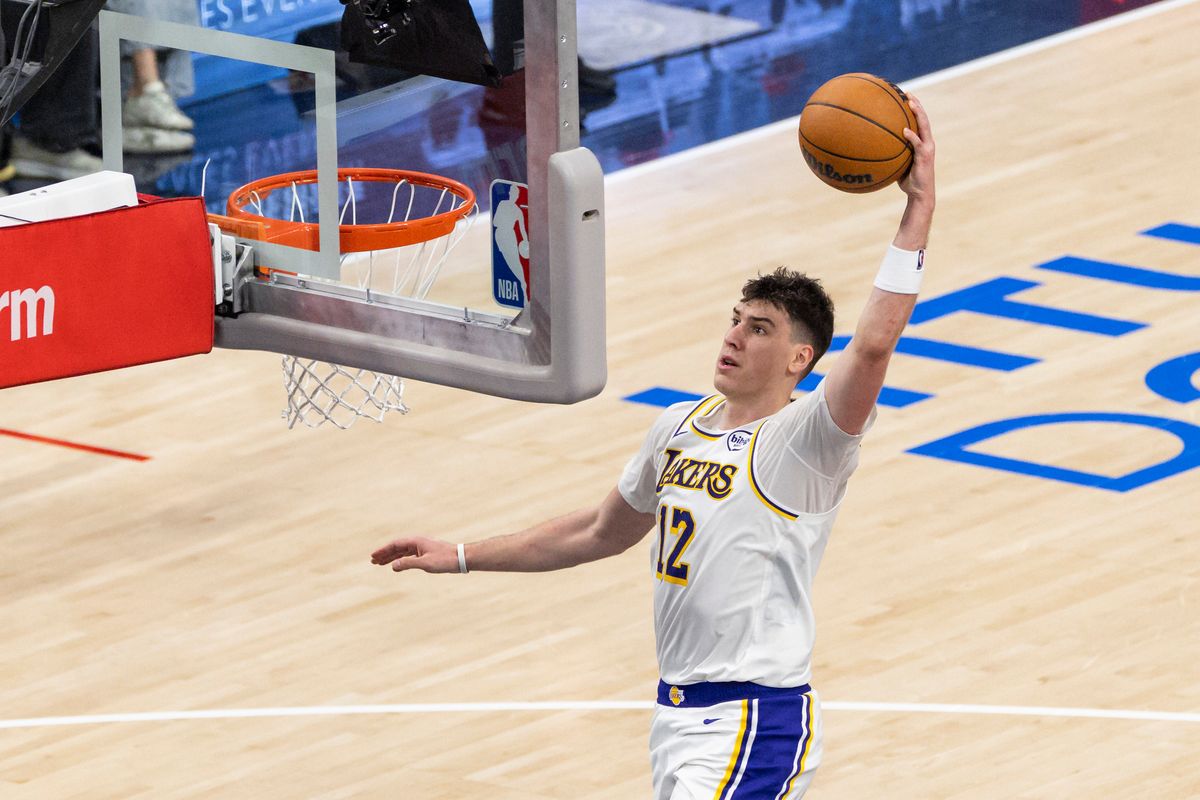 Jake LaRavia #12 of the Los Angeles Lakers dunks the ball during an NBA basketball game against the LA Clippers, Saturday December 20, 2025 in Inglewood, Calif.