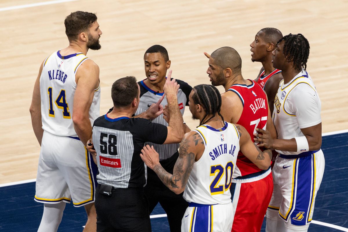Maxi Kleber #14 of the Los Angeles Lakers and Kris Dunn #8 of the LA Clippers have words after a play during an NBA basketball game, Saturday December 20, 2025 in Inglewood, Calif.