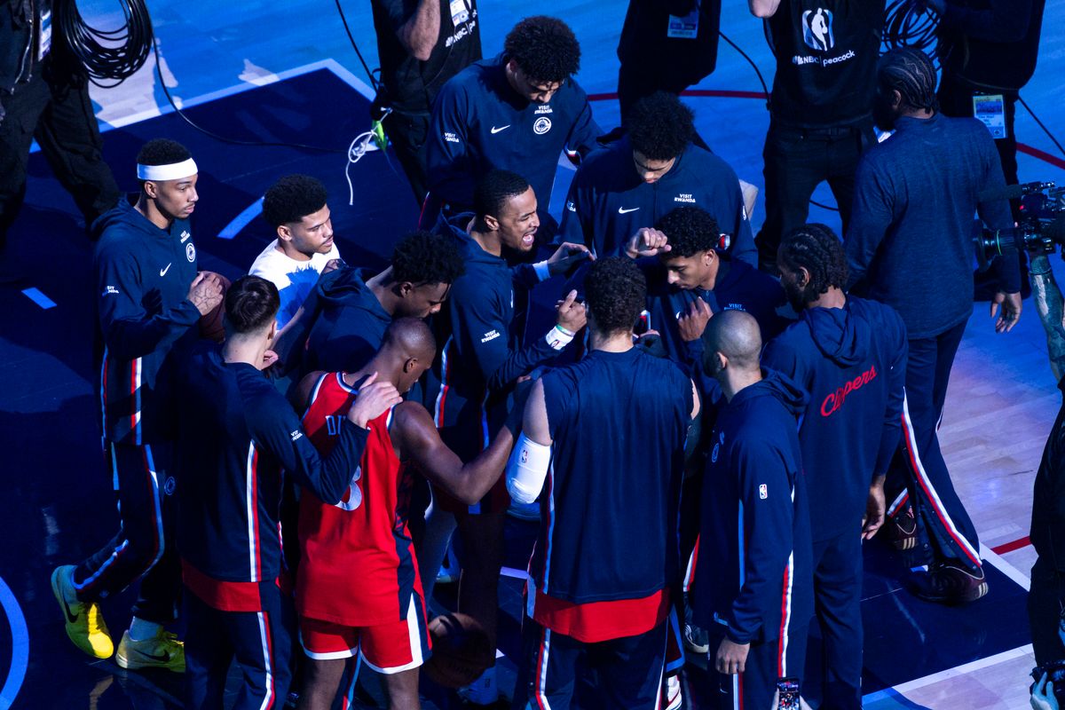 The LA Clippers huddle after the starting lineups are introduced before an NBA basketball game against the Houston Rockets, Tuesday December 23, 2025 in Inglewood, Calif.