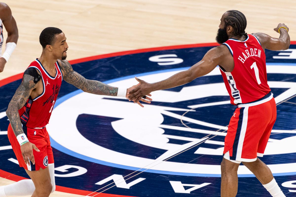 John Collins #20 of the LA Clippers and James Harden #1 of the LA Clippers high five during an NBA basketball game against the Houston Rockets, Tuesday December 23, 2025 in Inglewood, Calif.