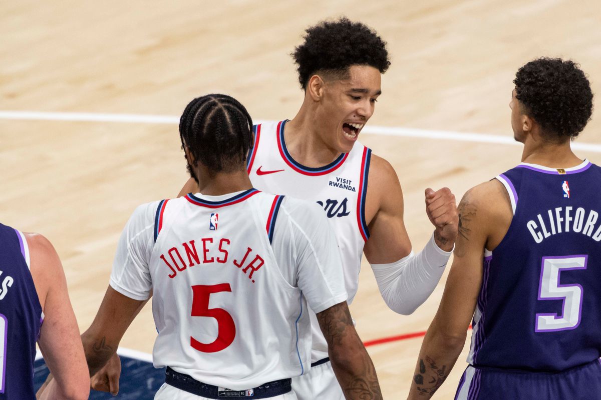 Yanic Konan Niederhauser #14 celebrates with Derrick Jones Jr. #5 of the LA Clippers during an NBA basketball game against the Sacramento Kings, Tuesday December 30, 2025 in Inglewood, Calif.