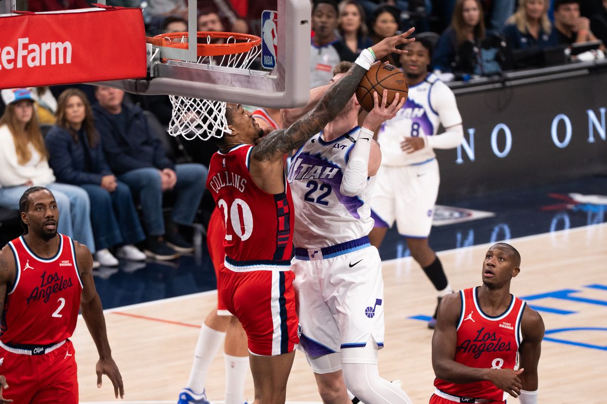 Los Angeles Clippers Forward John Collins (20) defends the rim and blocks his opponent during an NBA basketball game against the Utah Jazz, Thursday January 1st, 2026 in Inglewood, California. 