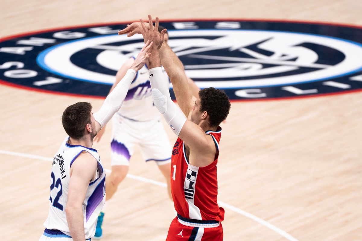 Los Angeles Clippers Center Brook Lopez (11) shoots a corner three over his defender during an NBA basketball game against the Utah Jazz, Thursday January 1st, 2026 in Inglewood, California. 