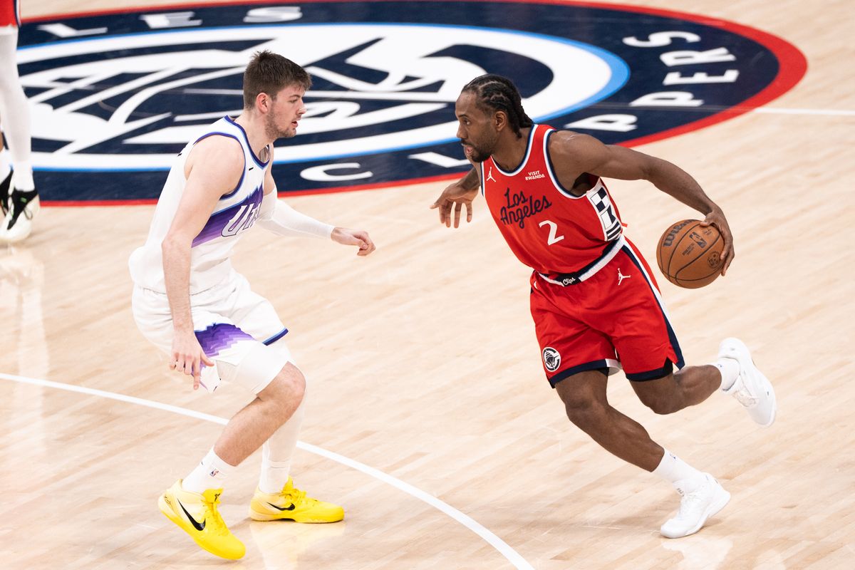 Los Angeles Clippers Forward Kawhi Leonard (2) attempts to dribble pass his opponent during an NBA basketball game against the Utah Jazz, Thursday January 1st, 2026 in Inglewood, California. 