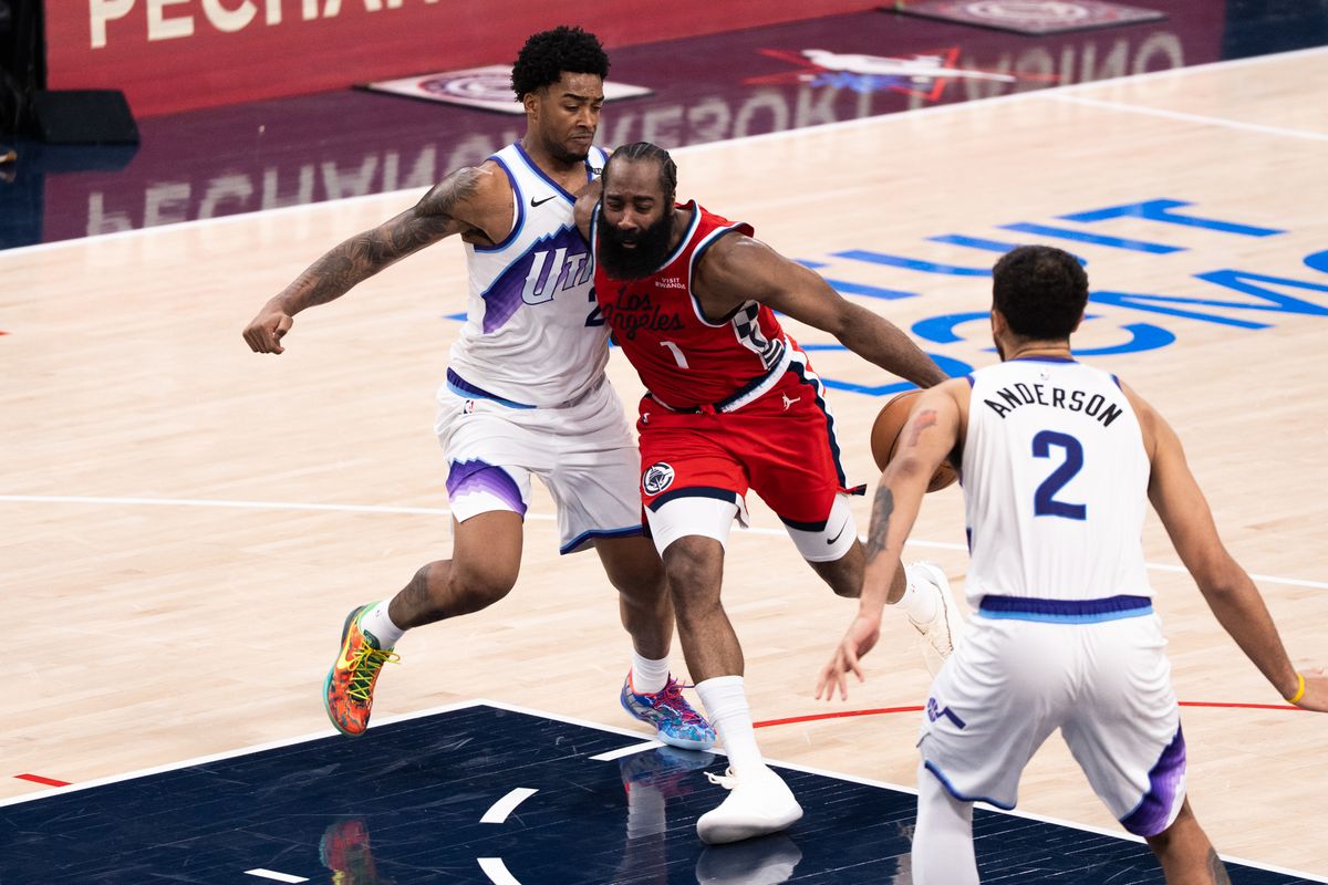 Los Angeles Clippers Guard James Harden (1) plays through an aggressive defender during an NBA basketball game against the Utah Jazz, Thursday January 1st, 2026 in Inglewood, California. 