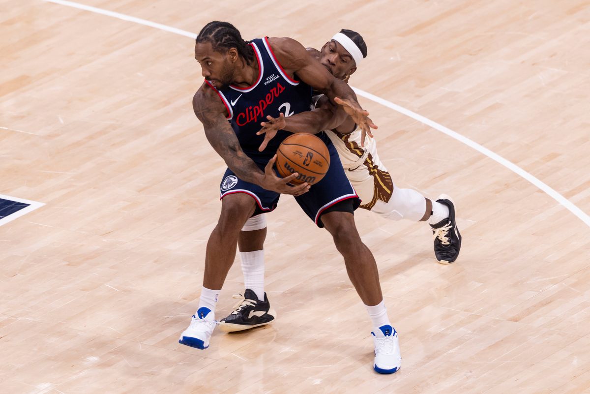 Jimmy Butler III #10 of the Golden State Warriors reaches for the ball held by Kawhi Leonard #2 of the LA Clippers during an NBA basketball game, Monday January 5, 2026 in Inglewood, Calif.