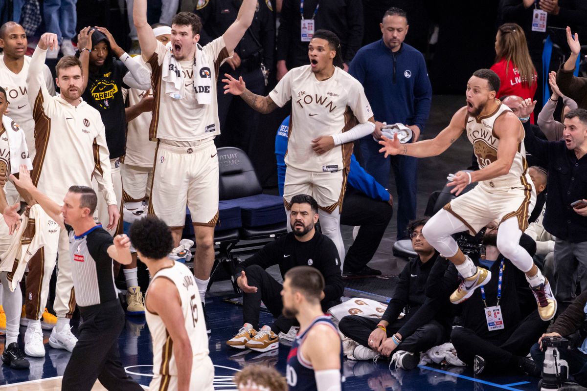 Stephen Curry #30 of the Golden State Warriors and teammates on the bench react to a no shot call after a made basket during an NBA basketball game against the LA Clippers, Monday January 5, 2026 in Inglewood, Calif.