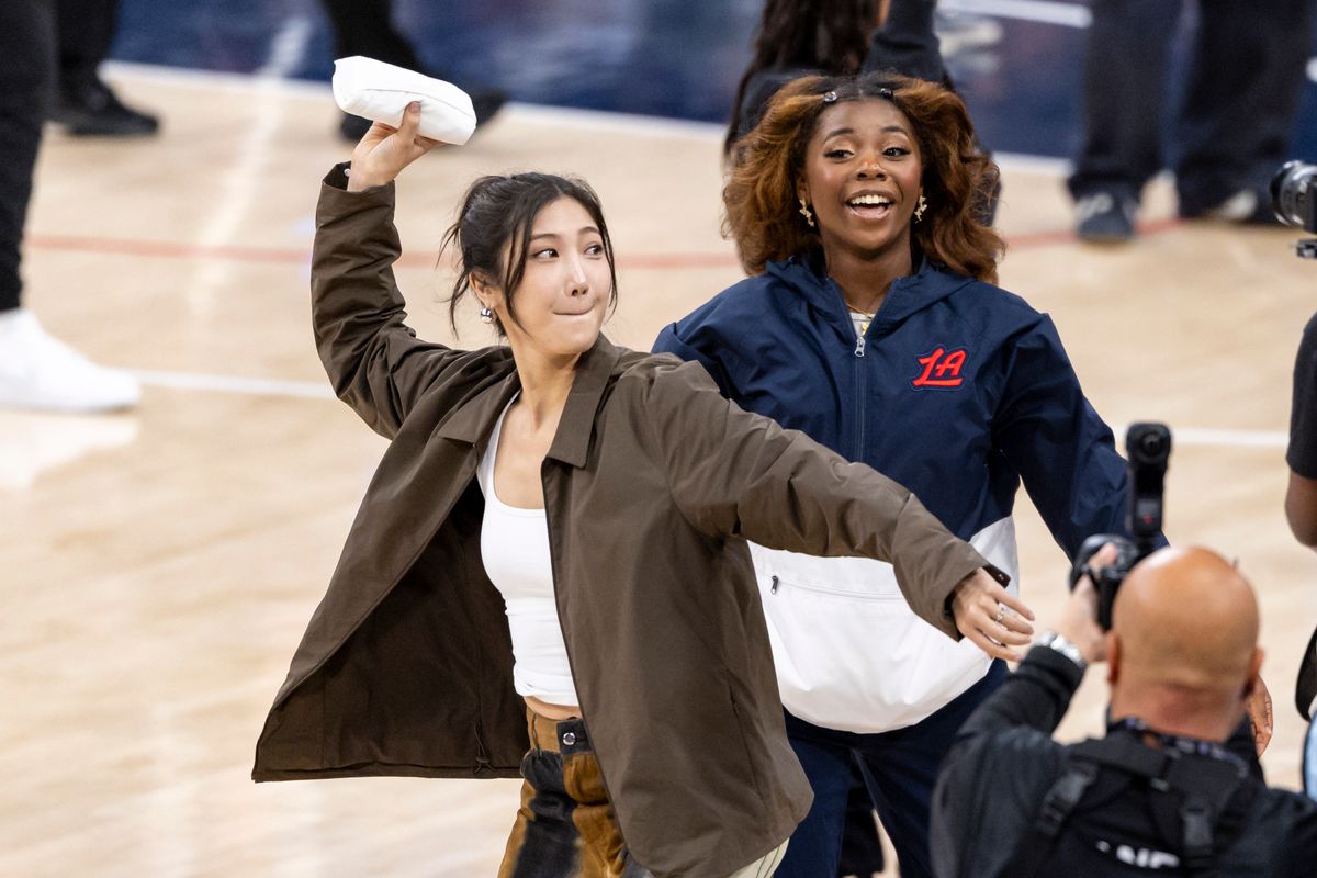EJAE of the K-Pop band HUNTR/X throws t-shirts to the crowd during the Korean Heritage Night game between the LA Clippers and Charlotte Hornets, Monday January 12, 2026 in Inglewood, Calif.