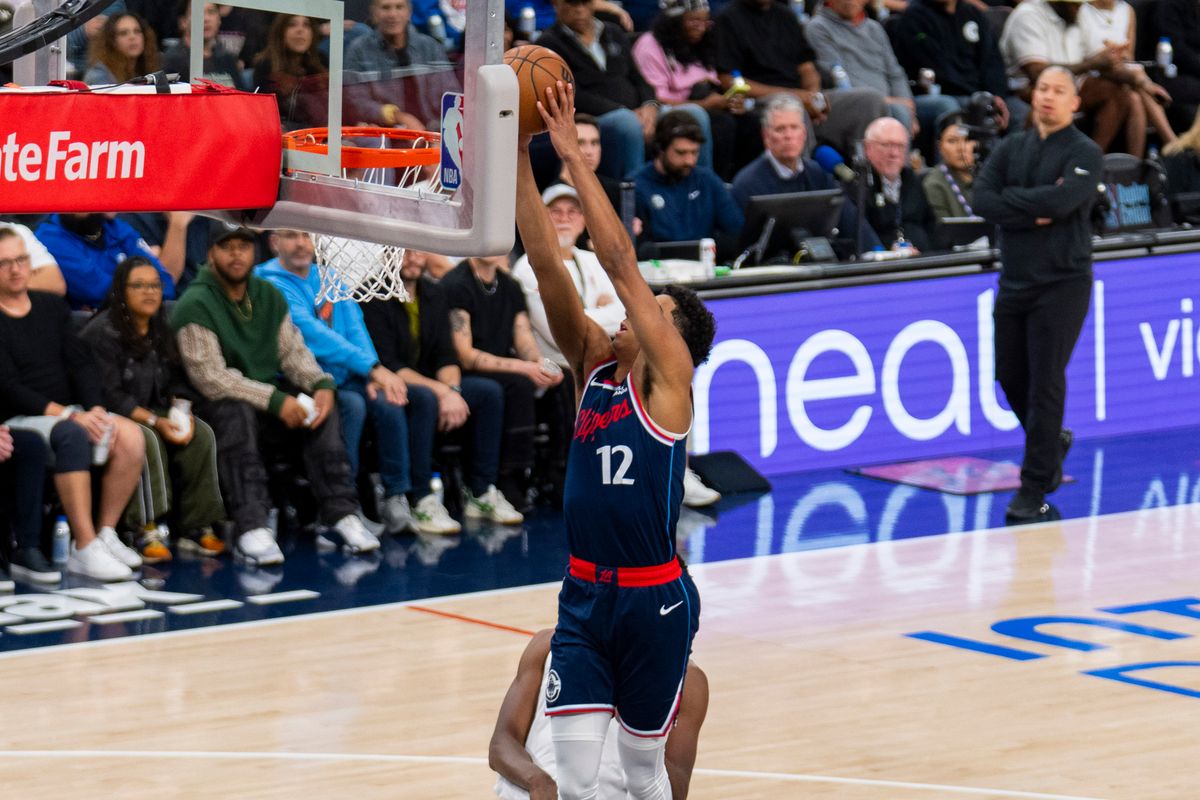 Los Angeles Clippers guard Cam Christie (12) finishes the fast break dunk during an NBA basketball game against the Cleveland Cavaliers, Wednesday February 4th, 2026 in Los Angeles, California.